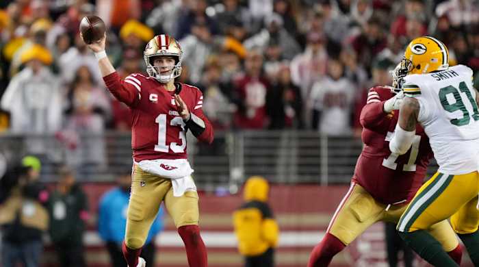 San Francisco 49ers quarterback Brock Purdy (13) throws a pass against the Green Bay Packers during the fourth quarter in a 2024 NFC divisional round game at Levi’s Stadium.